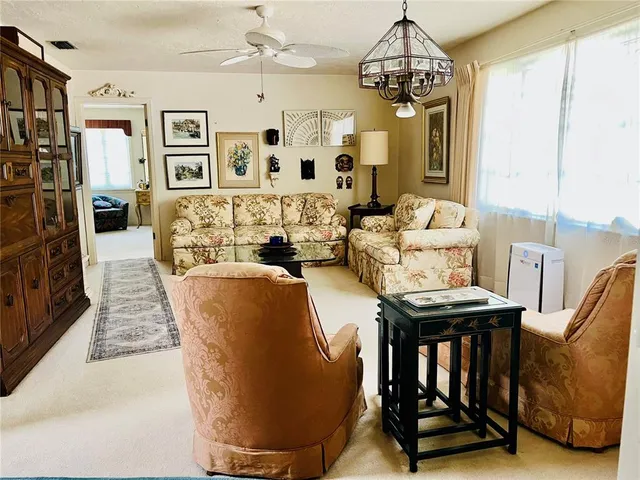 a kitchen with stainless steel appliances a stove a sink and a microwave