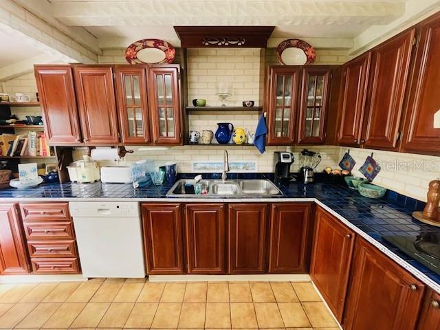 550 46th Street Sarasota, FL 34234 - Photo 16 of 48 a kitchen with stainless steel appliances a stove a sink and a microwave