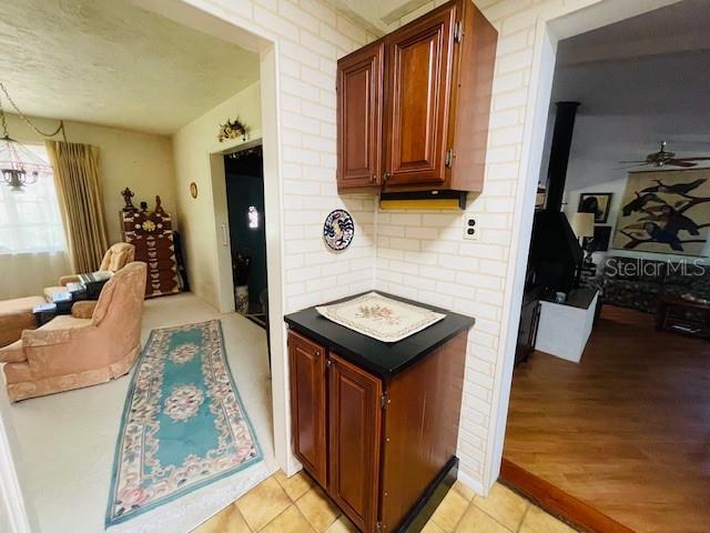 550 46th Street Sarasota, FL 34234 - Photo 17 of 48 a view of a kitchen area with furniture and wooden floor