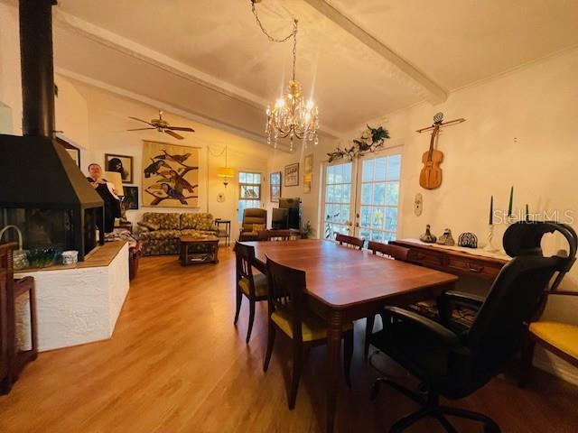 550 46th Street Sarasota, FL 34234 - Photo 19 of 48 a view of a dining room with furniture and wooden floor