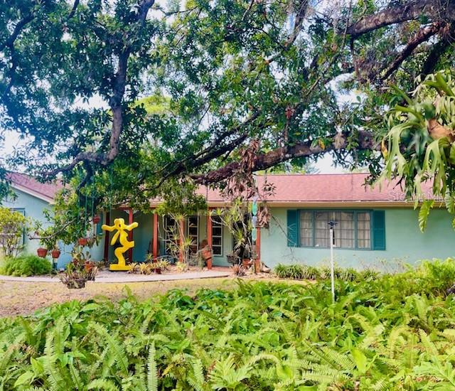 550 46th Street Sarasota, FL 34234 - Photo 2 of 48 a view of a building with large trees