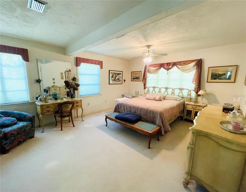 550 46th Street Sarasota, FL 34234 - Photo 23 of 48 a bedroom with furniture and a bed