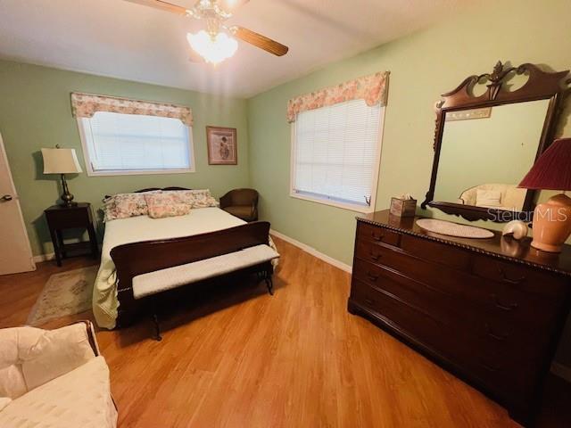 550 46th Street Sarasota, FL 34234 - Photo 27 of 48 a bedroom with a bed and a mirror
