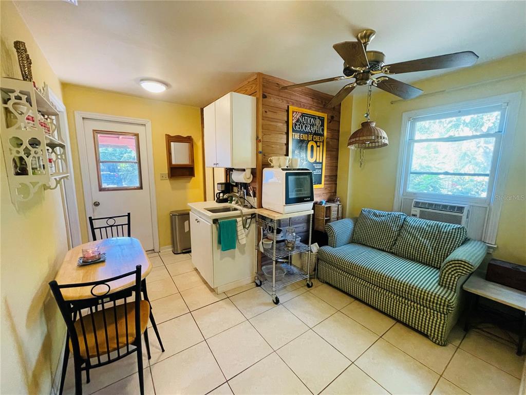 550 46th Street Sarasota, FL 34234 - Photo 32 of 48 a living room with furniture and a window