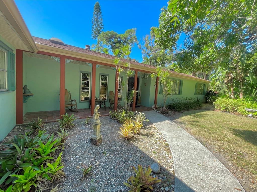 550 46th Street Sarasota, FL 34234 - Photo 5 of 48 a view of a house with potted plants
