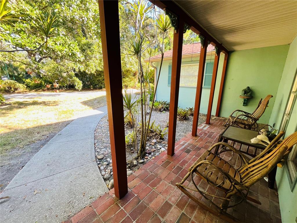 550 46th Street Sarasota, FL 34234 - Photo 6 of 48 a view of swimming pool with outdoor seating