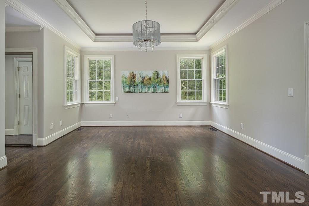 4901 Grilse Way Raleigh, NC 27613 - Photo 10 of 19 The spacious master bedroom offers a trey ceiling and gorgeous HARDWOOD floors!