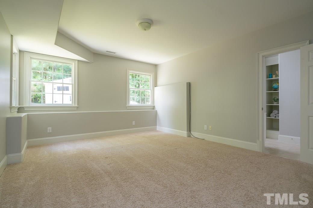4901 Grilse Way Raleigh, NC 27613 - Photo 12 of 19 Secondary bedroom features a private bath.