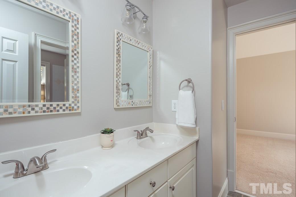 4901 Grilse Way Raleigh, NC 27613 - Photo 15 of 19 Secondary bathroom features a double vanity that's convenient for family members and guests!