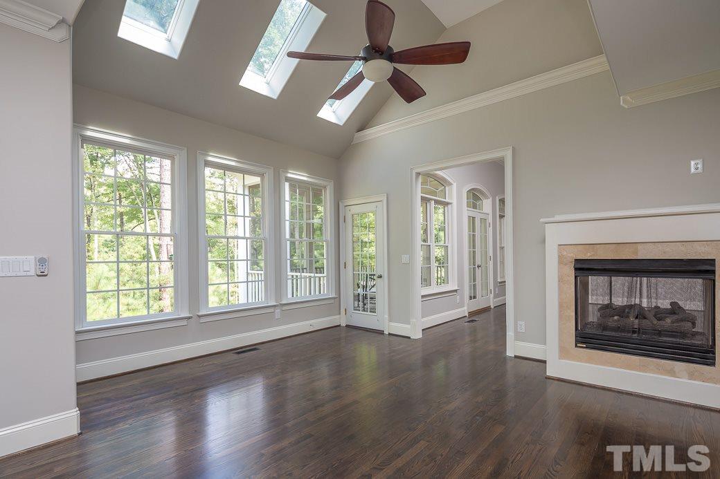 4901 Grilse Way Raleigh, NC 27613 - Photo 9 of 19 Ample natural light is abundant in this sunroom that provides direct access to the screened porch.