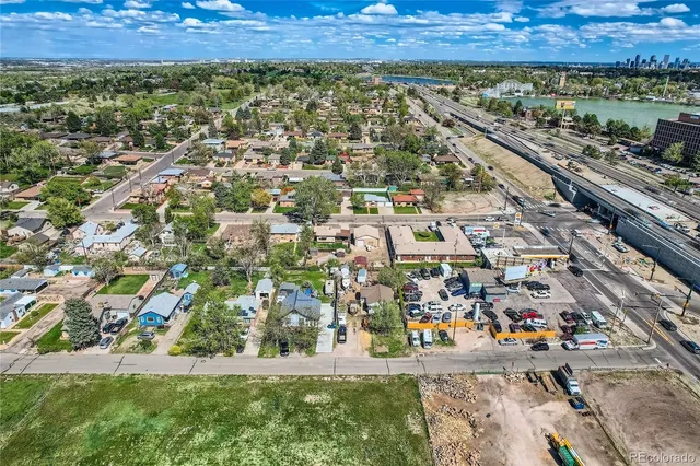 an aerial view of residential building and car parked