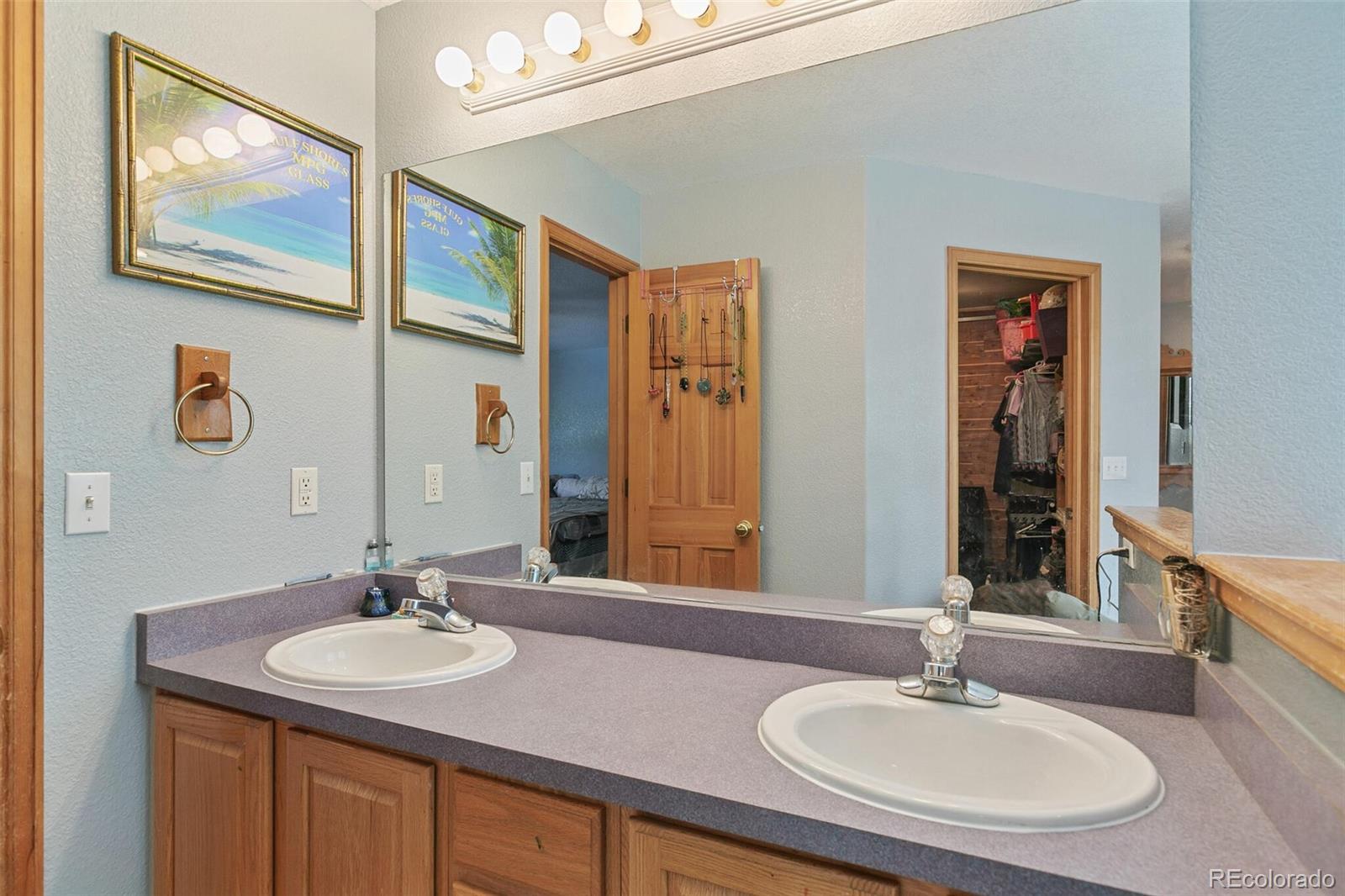 30 Bristlecone Circle Bailey, CO 80421 - Photo 19 of 35 a bathroom with 2 sink and a mirror