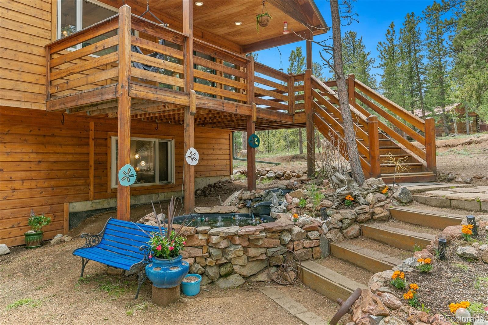 30 Bristlecone Circle Bailey, CO 80421 - Photo 2 of 35 a backyard of a house with outdoor seating