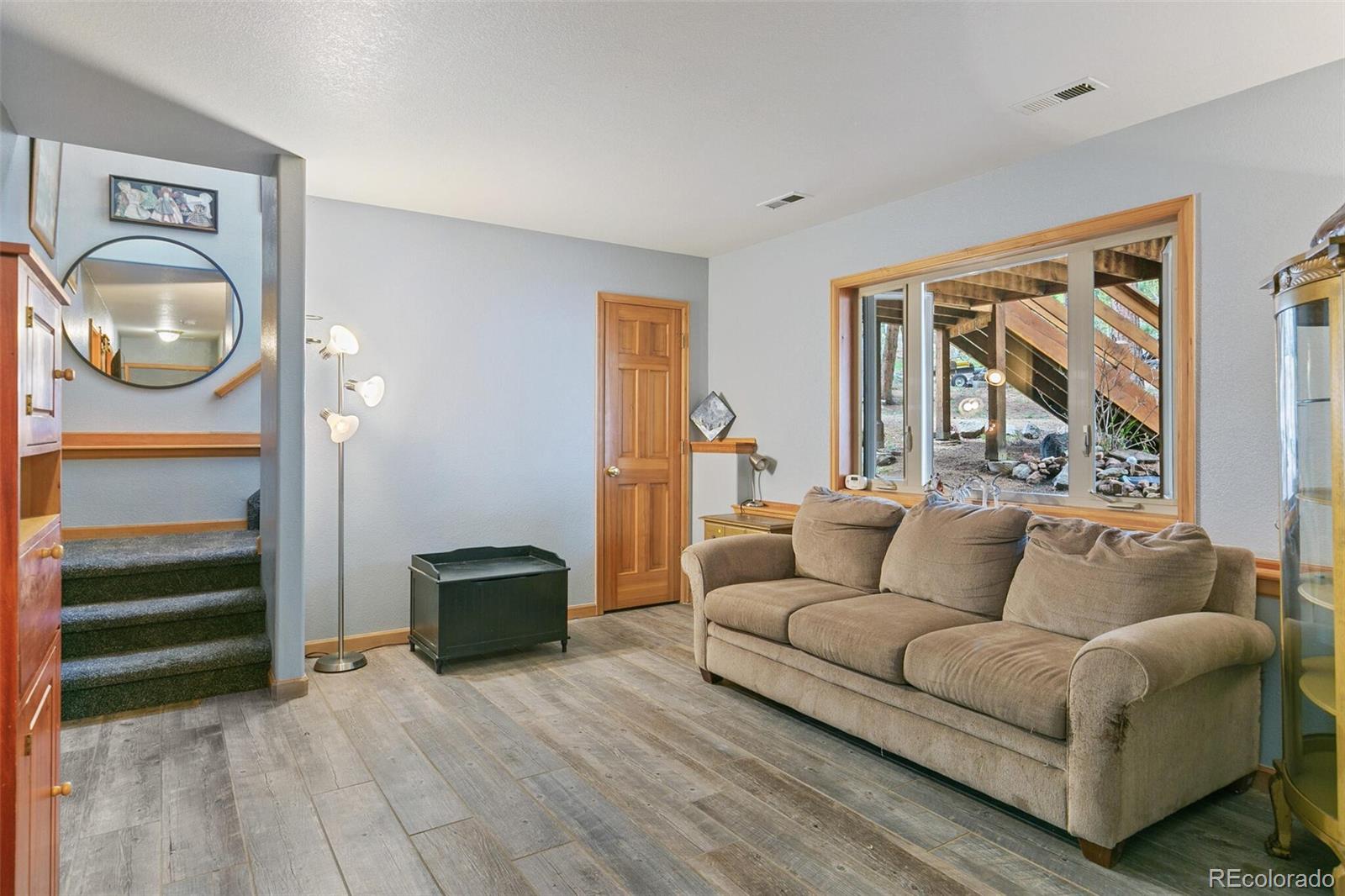 30 Bristlecone Circle Bailey, CO 80421 - Photo 22 of 35 a living room with furniture and a window