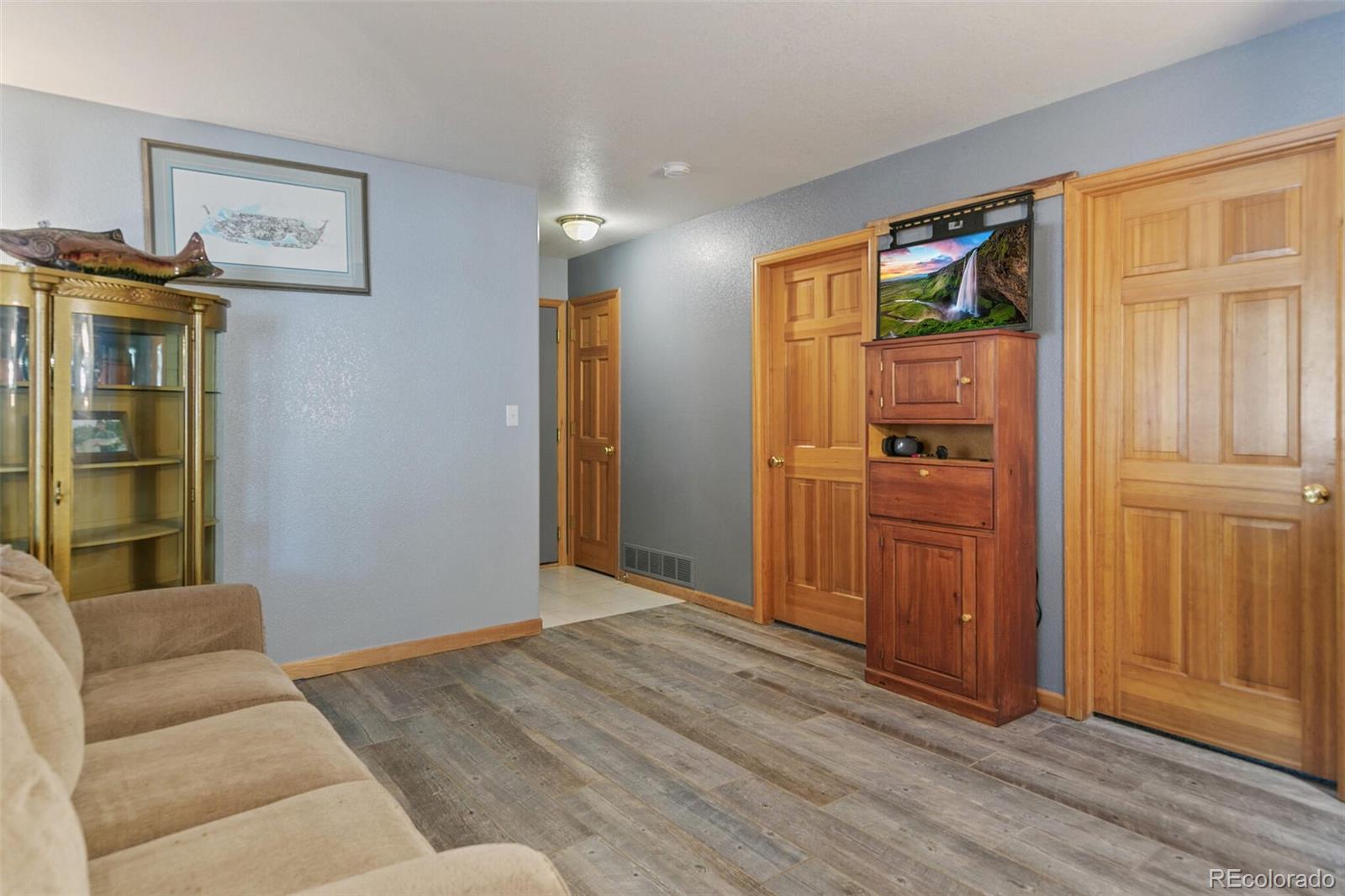 30 Bristlecone Circle Bailey, CO 80421 - Photo 23 of 35 a view of a livingroom with wooden floor and kitchen space