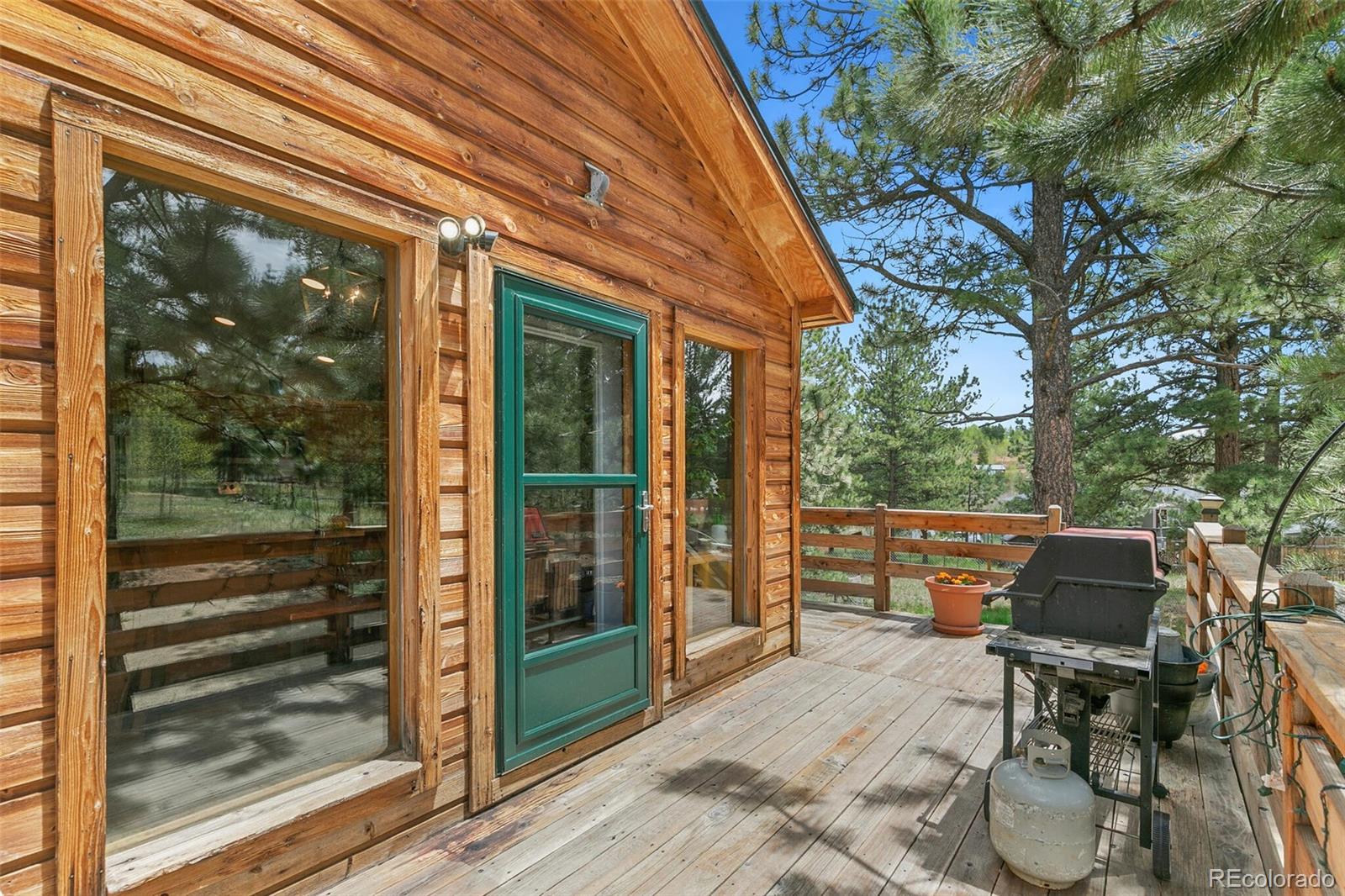 30 Bristlecone Circle Bailey, CO 80421 - Photo 27 of 35 a balcony with furniture and wooden floor