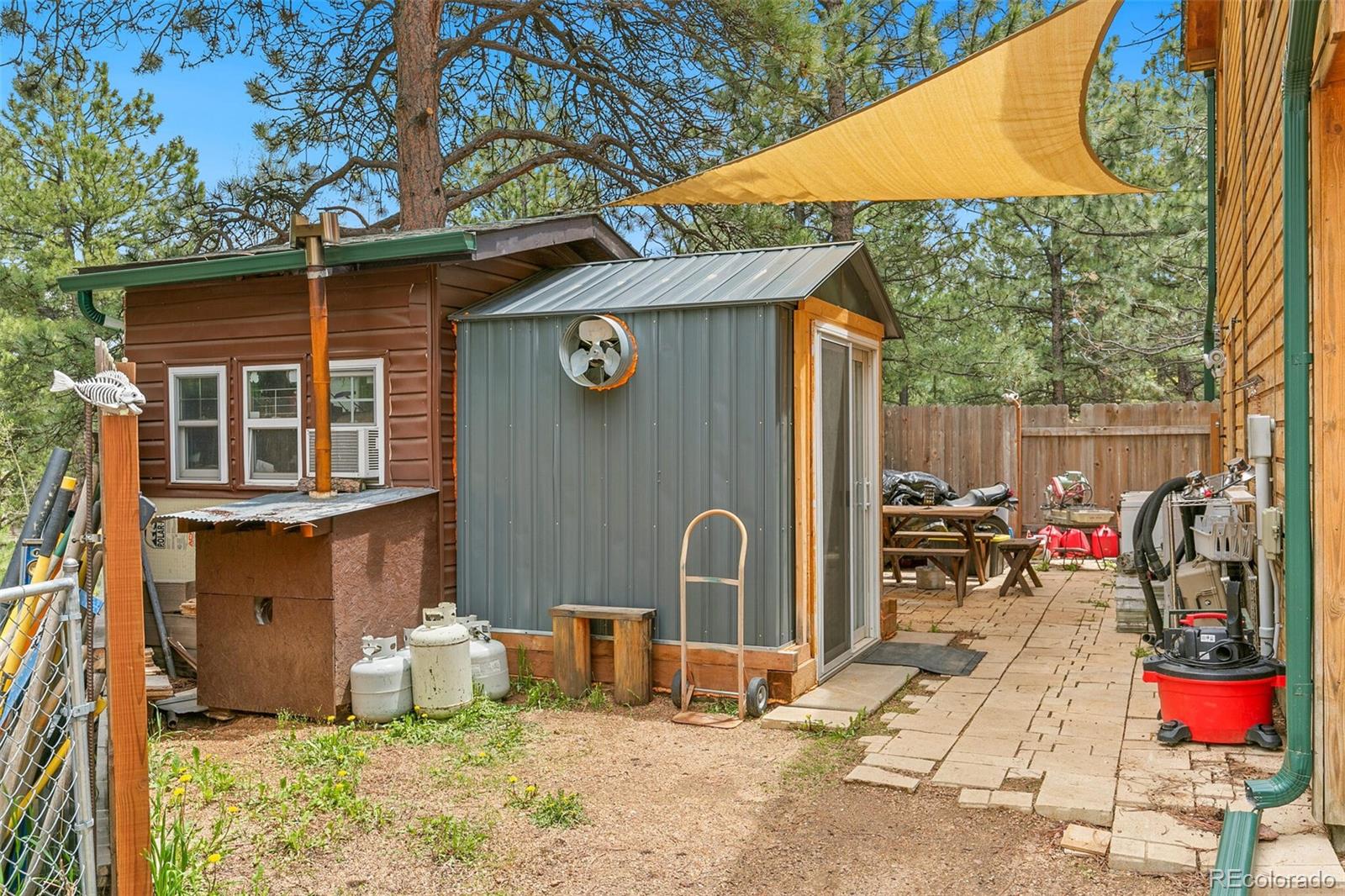 30 Bristlecone Circle Bailey, CO 80421 - Photo 29 of 35 a backyard of a house with seating space