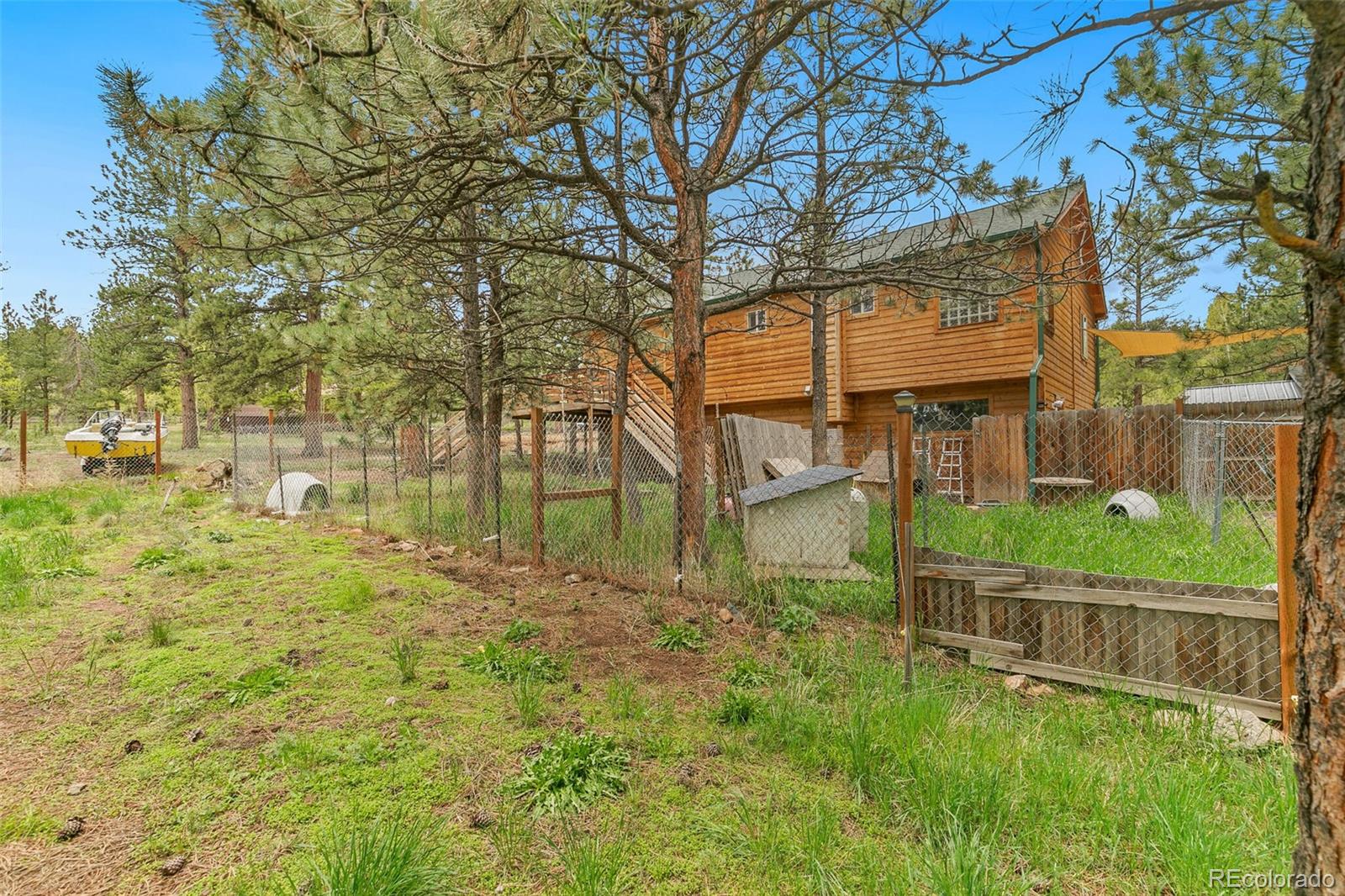 30 Bristlecone Circle Bailey, CO 80421 - Photo 31 of 35 a view of a house with a yard and wooden fence
