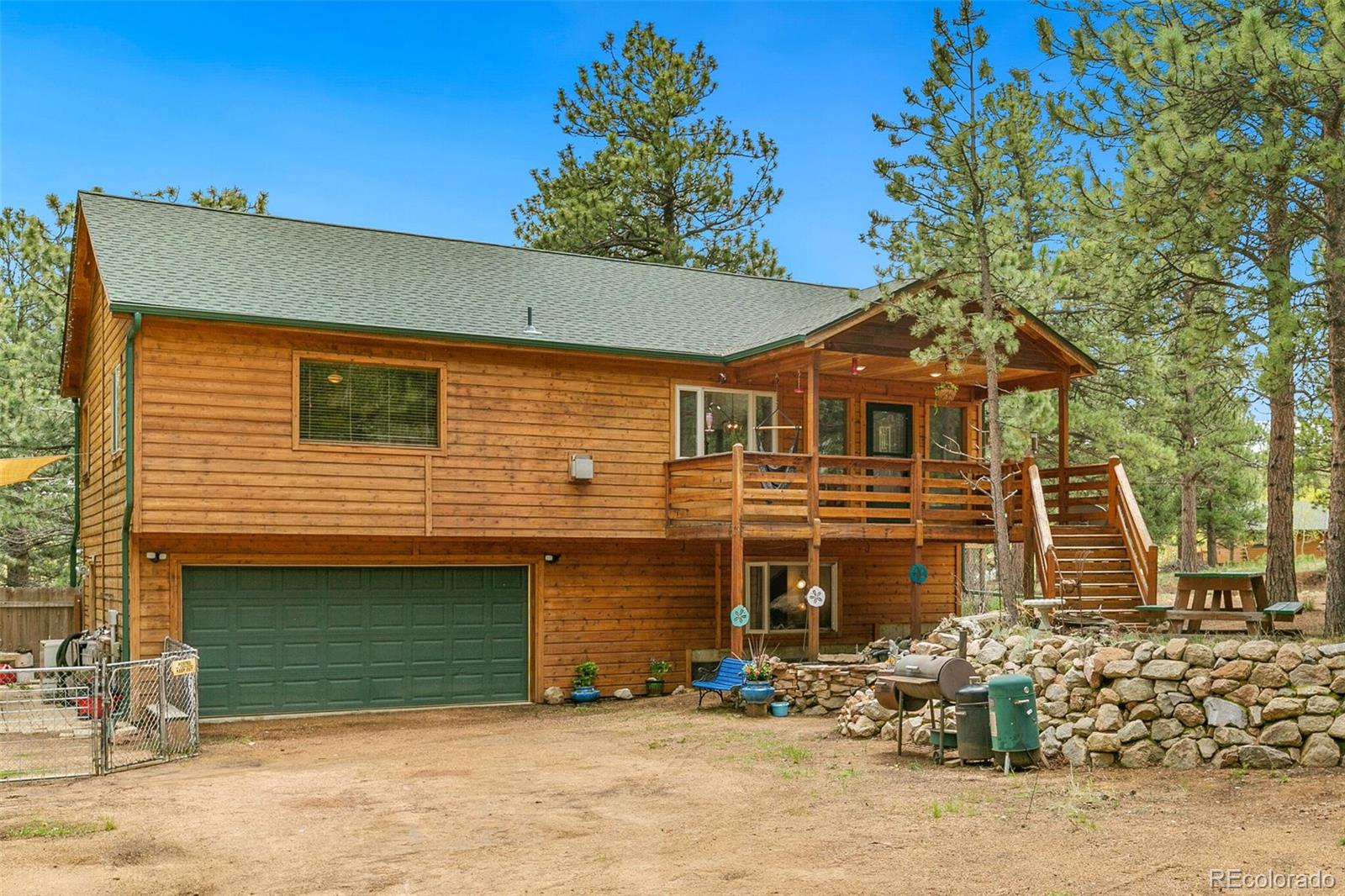 30 Bristlecone Circle Bailey, CO 80421 - Photo 34 of 35 a front view of a house with a yard