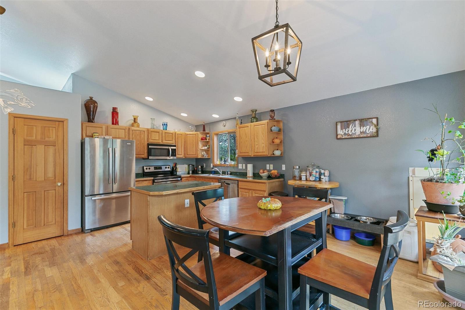 30 Bristlecone Circle Bailey, CO 80421 - Photo 8 of 35 a kitchen with a dining table and chairs
