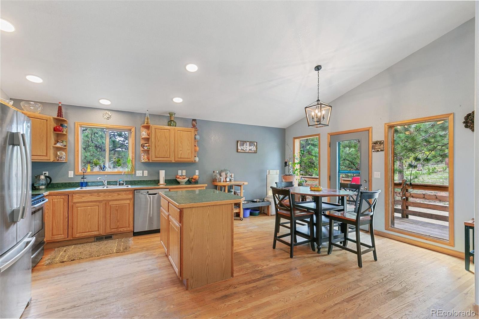 30 Bristlecone Circle Bailey, CO 80421 - Photo 9 of 35 a kitchen with stainless steel appliances granite countertop sink stove top oven and cabinets