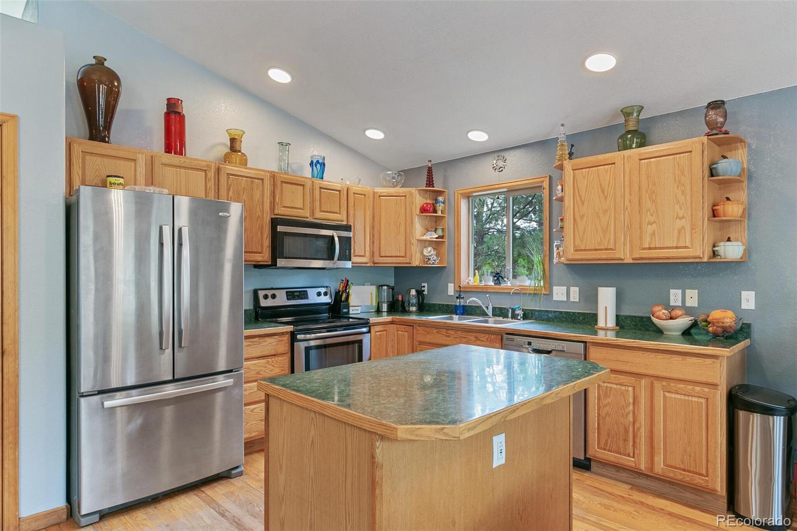 30 Bristlecone Circle Bailey, CO 80421 - Photo 10 of 35 a kitchen with stainless steel appliances granite countertop a refrigerator a sink a stove and a refrigerator