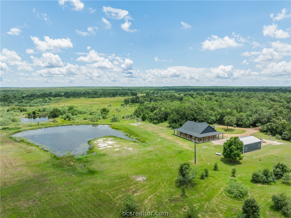 6951 Watermelon Road Somerville, TX 77879 - Photo 38 of 48 Imagine starting your mornings with coffee overlooking your own pond, watching wildlife from the back porch, and ending the day under the wide-open Texas sky. Whether you're looking for space for horses, 4-H projects, a hobby farm, gardening, or simply room to breathe, this property provides the flexibility to create the lifestyle you've been dreaming about.