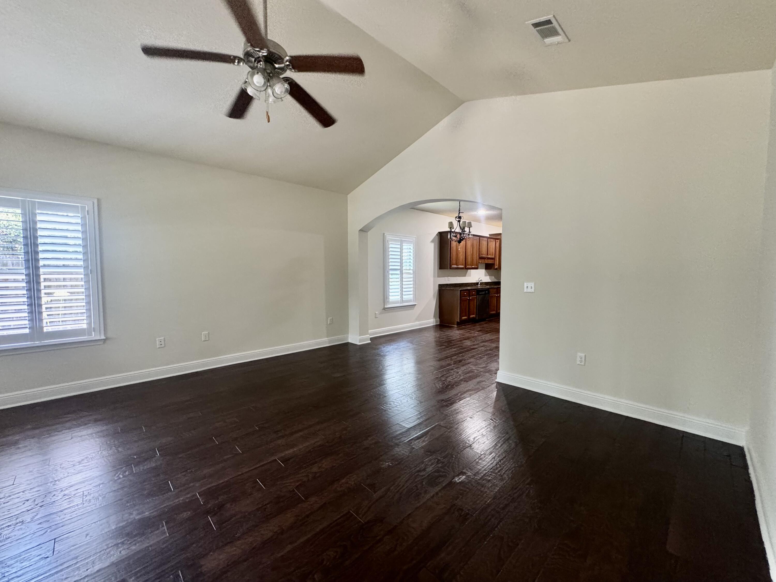 256 Cocobolo Drive Santa Rosa Beach, FL 32459 - Photo 11 of 22 wooden floor in an empty room with a window