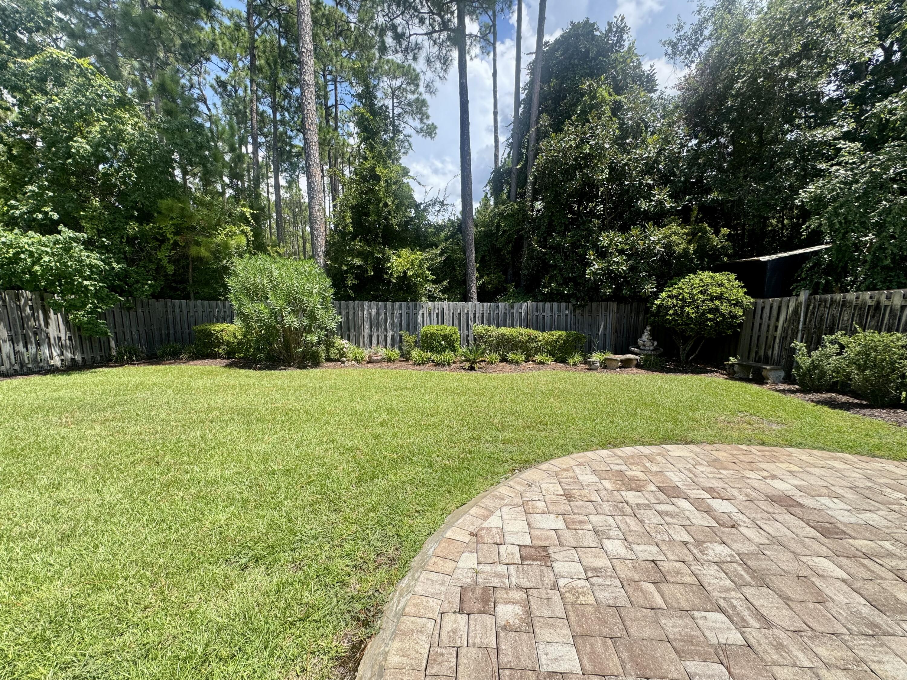 256 Cocobolo Drive Santa Rosa Beach, FL 32459 - Photo 2 of 22 a view of a garden with a pathway