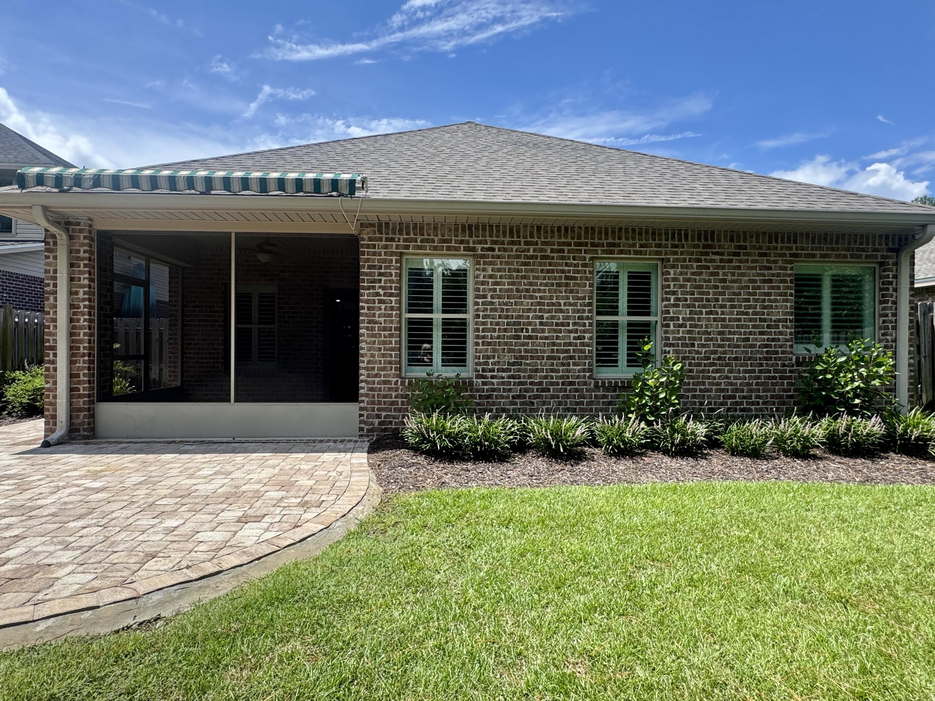 256 Cocobolo Drive Santa Rosa Beach, FL 32459 - Photo 4 of 22 a view of a house with garden