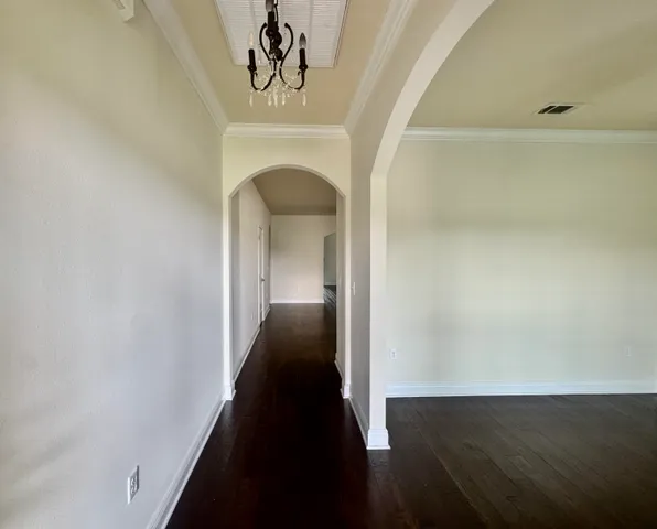 a view of entryway and hall with a front door