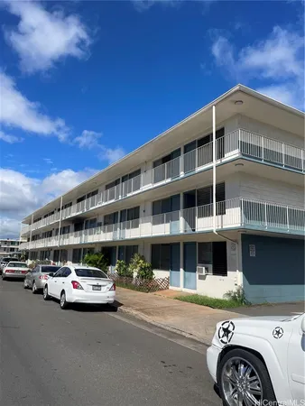 a front view of a building with parking space