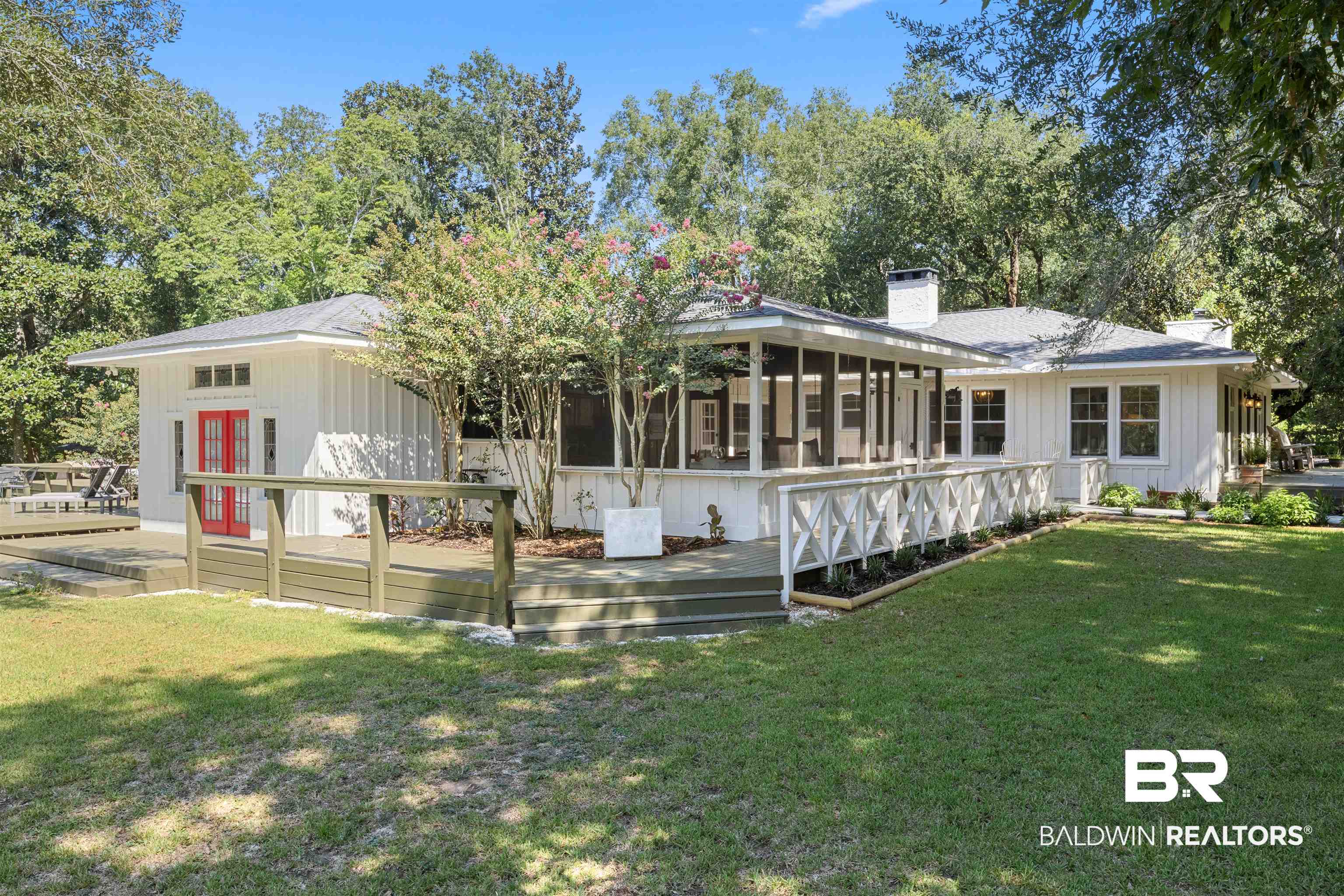 15100 Vasko Road Silverhill, AL 36576 - Photo 36 of 51 Back of house featuring a wooden deck and a yard