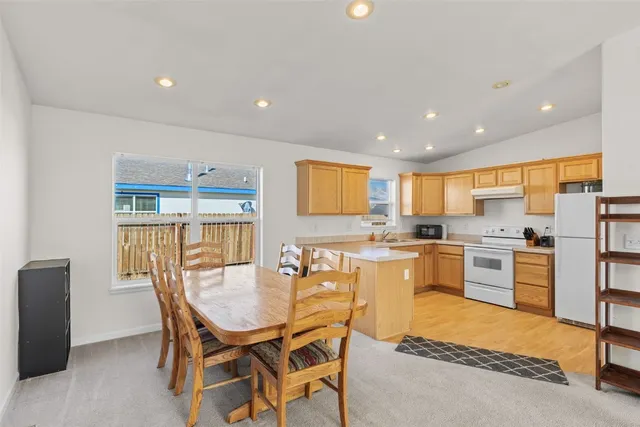 a view of a dining room with furniture