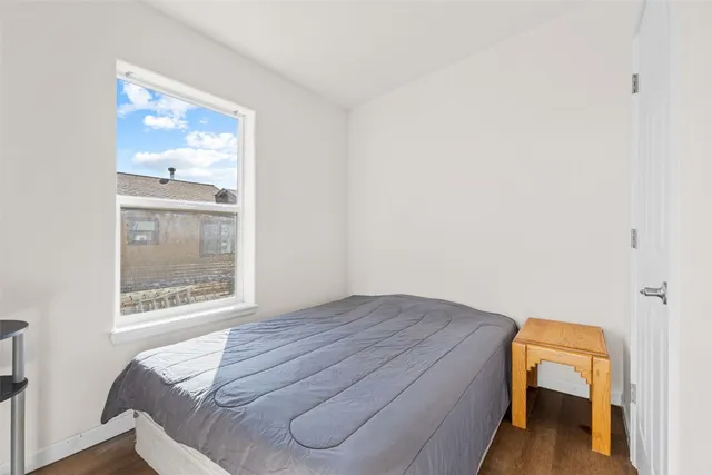 a room with a bed and a window