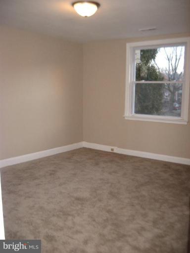 916 Andover Road Baltimore, MD 21218 - Photo 20 of 30 an empty room with a window