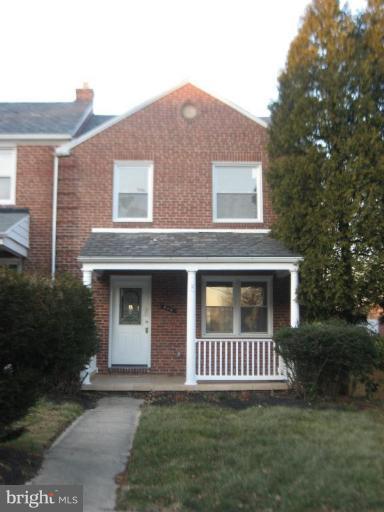 916 Andover Road Baltimore, MD 21218 - Photo 3 of 30 a view of a brick house with a yard