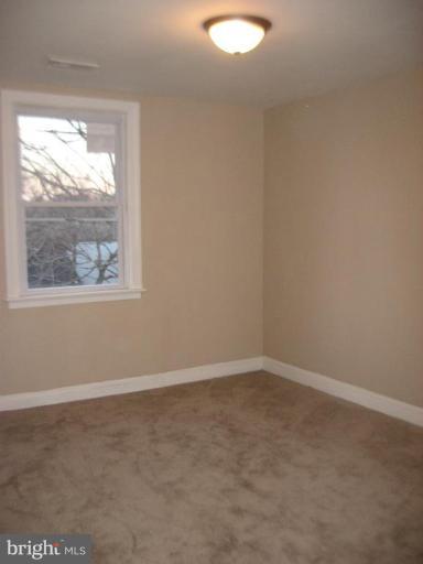 916 Andover Road Baltimore, MD 21218 - Photo 21 of 30 an empty room with a window