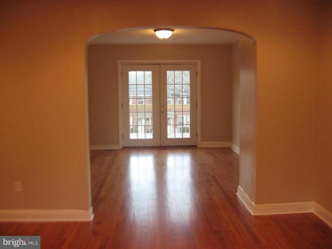 916 Andover Road Baltimore, MD 21218 - Photo 30 of 30 wooden floor in an empty room with a window