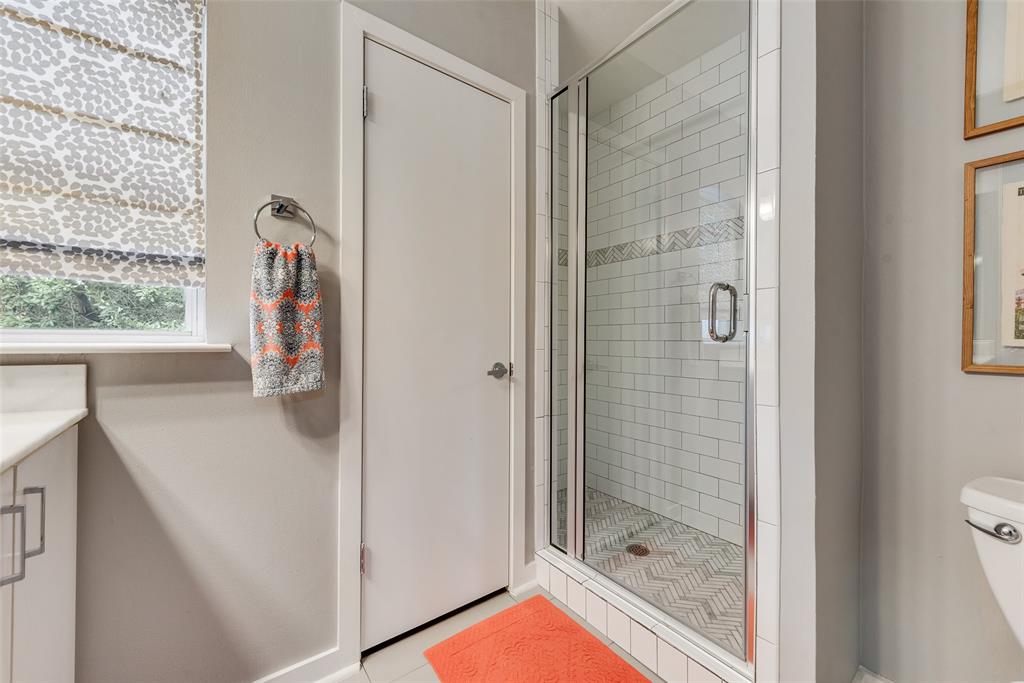 3922 Gilbert Avenue, Unit 220 Dallas, TX 75219 - Photo 15 of 19 a bathroom with a shower and a sink