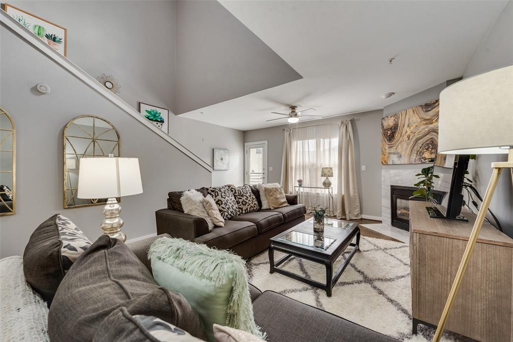 3922 Gilbert Avenue, Unit 220 Dallas, TX 75219 - Photo 3 of 19 a living room with furniture and wooden floor
