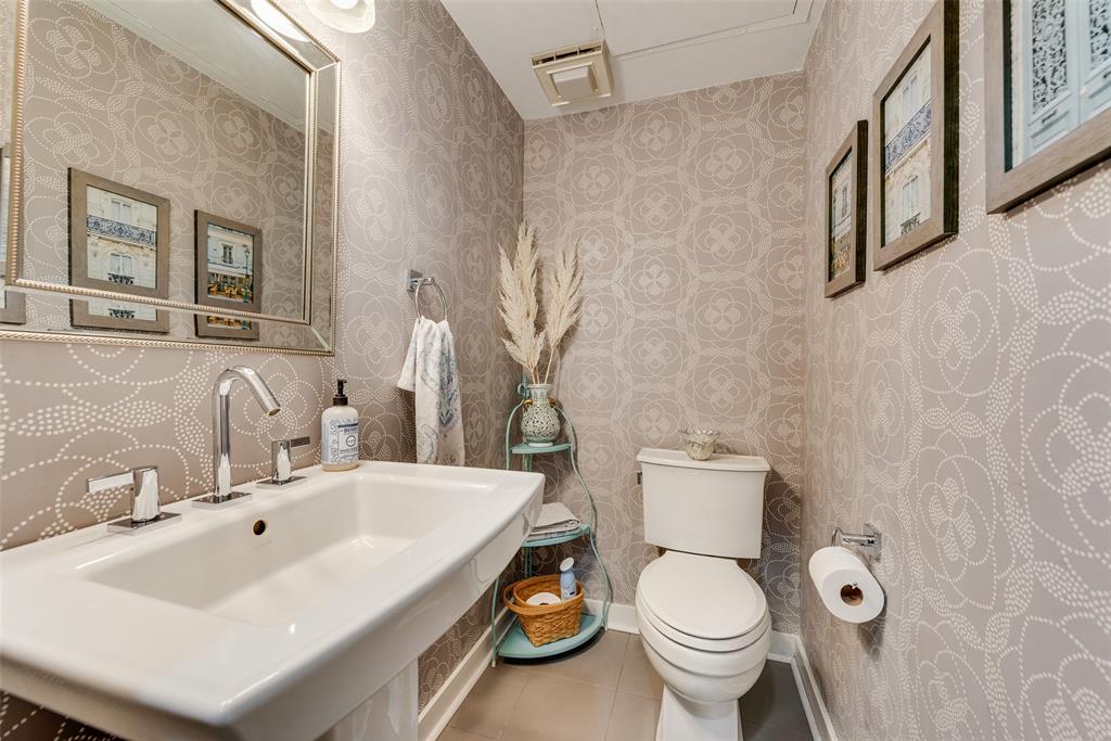 3922 Gilbert Avenue, Unit 220 Dallas, TX 75219 - Photo 7 of 19 a white toilet sitting next to a bathroom sink