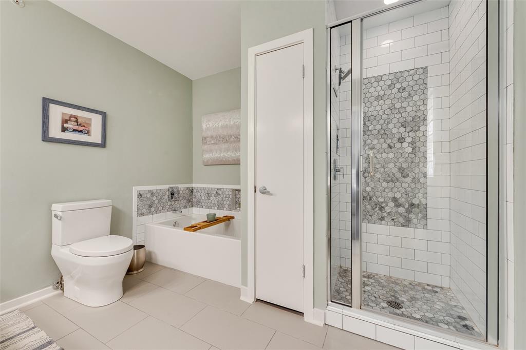 3922 Gilbert Avenue, Unit 220 Dallas, TX 75219 - Photo 10 of 19 a bathroom with a toilet sink and shower