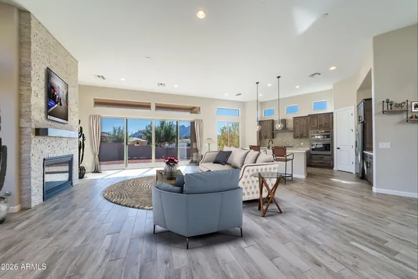 a living room with fireplace furniture and a flat screen tv