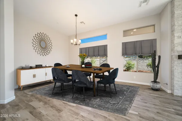 a view of a dining room with furniture window and wooden floor