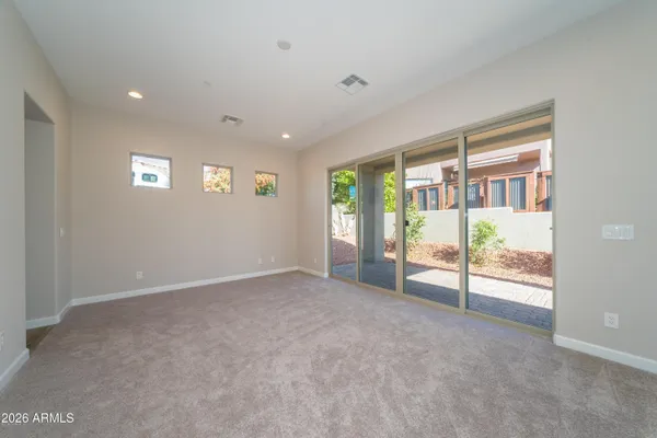 a view of an empty room with a sliding door