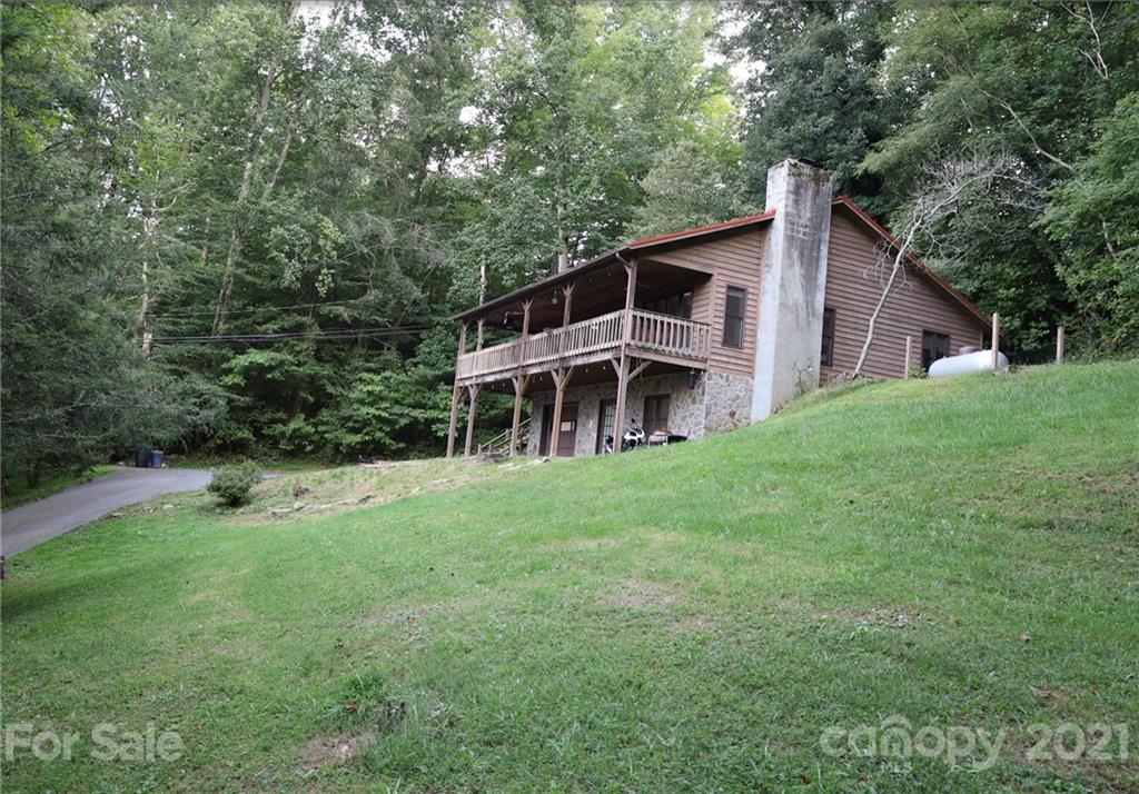 263 Cedar Rock Road Waynesville, NC 28786 - Photo 2 of 20 a front view of a house with a yard