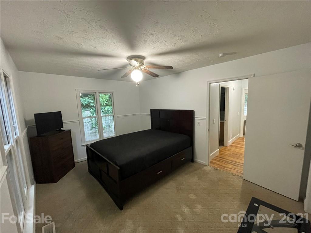263 Cedar Rock Road Waynesville, NC 28786 - Photo 16 of 20 a living room with furniture and a window
