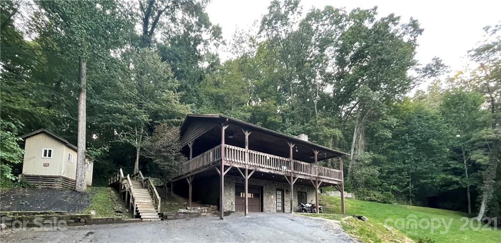 263 Cedar Rock Road Waynesville, NC 28786 - Photo 18 of 20 a front view of a house with a yard
