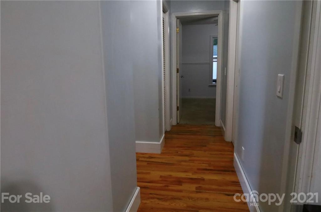263 Cedar Rock Road Waynesville, NC 28786 - Photo 9 of 20 a view of a hallway with wooden floor